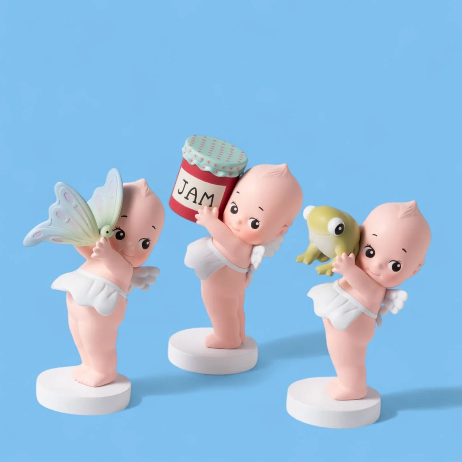 Kewpie Doll Holding Things